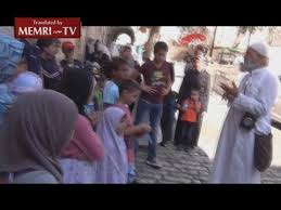 Arab Passerby Scolds Muslim preacher in Jerusalem for teaching young children to commit Murder – Suicide